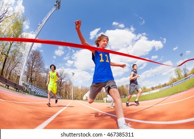 Happy Teenage Sprinter Coming First To Finish Line