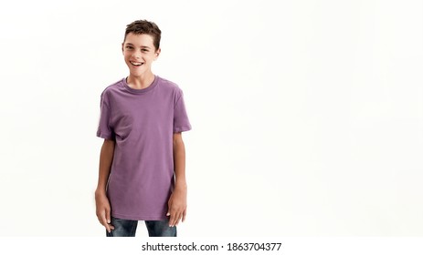 Happy teenaged disabled boy with cerebral palsy smiling at camera while posing, standing isolated over white background. Children with disabilities and special needs concept. Web Banner