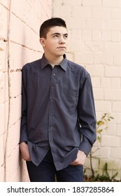 Happy Teenager Boy Grimace Wink Close Up Portrait On White Wall Background