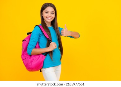 Happy Teenager Portrait. Back To School. Teenage School Girl Ready To Learn. School Children On Yellow Isolated Background. Smiling Girl.