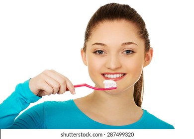 Happy Teenager Woman Brushing Teeth.