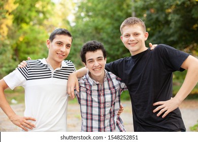 happy teens friends outdoors in park