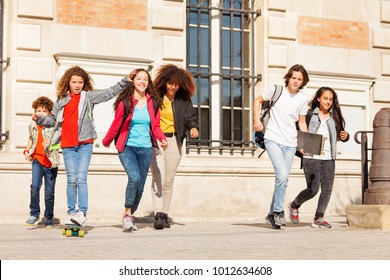 Happy Teens Having Fun At College Campus