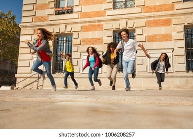 Happy Teens Running After Classes At Sunny Day