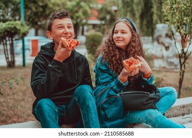 Happy Teens Students Eating Outdoor On School Lunch.