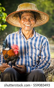 A Happy Thai Farmer And His Roost.