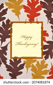 Happy Thanksgiving concept. Fall leaves background and a Happy Thanksgiving greeting.