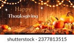 Happy Thanksgiving Day background, wooden table decorated with Pumpkins, Corncob, Candles and garland. 
