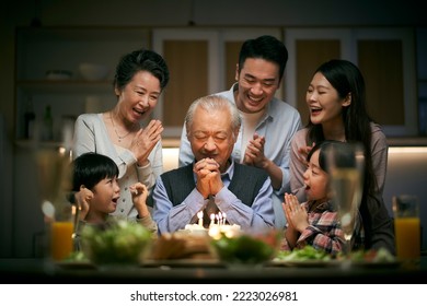 happy three generation asian family celebrating grandpa's birthday at home - Powered by Shutterstock