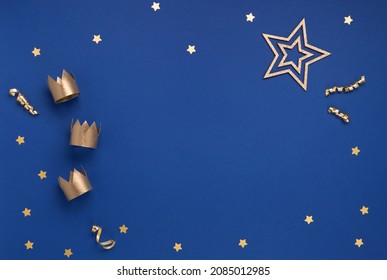 Happy Three King's Day, of January 6. Three gold crowns on blue background. Concept for Dia de Reyes Magos day, three Wise Men. Epiphany day. Top view, copy space, flat lay. - Powered by Shutterstock