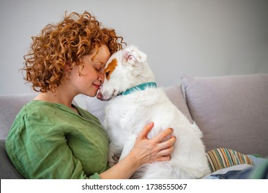 Happy Time With Pet. Girl Huging New Lovely Member Of Family. Pet Care And Animals Concept. Smiling Woman Holding Cute, Small Dog On Lap. Woman Playing With Her Dogs