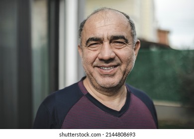 Happy and tired middle eastern man looking at the camera selective focus outdoor real people portrait - Powered by Shutterstock