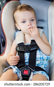 Happy Toddler Boy In The Car Eating Cookies