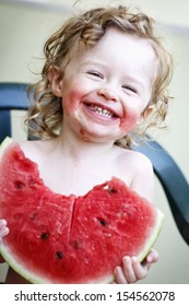 Happy Toddler Eating Melon