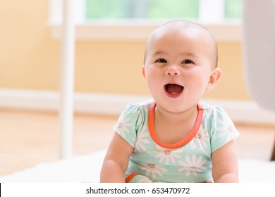 Happy Toddler Girl With Big Smile In Her House