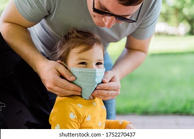 Happy Toddler Girl In Medical Mask Outdoors. New Normal Summer 2020. Preschool Child