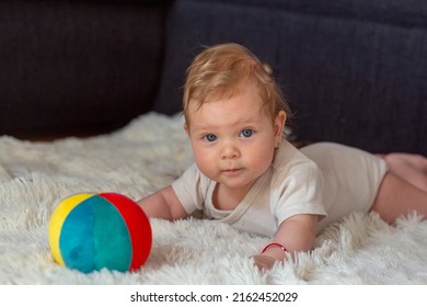 Happy  Toddler kid with balls for children.