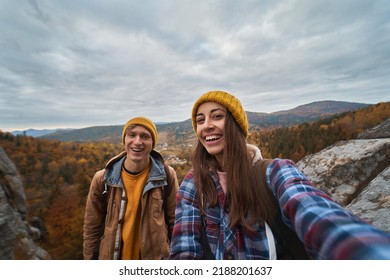 Happy tourist couple making selfie with nature view during travel together, enjoying active lifestyle vacations outdoors - Powered by Shutterstock