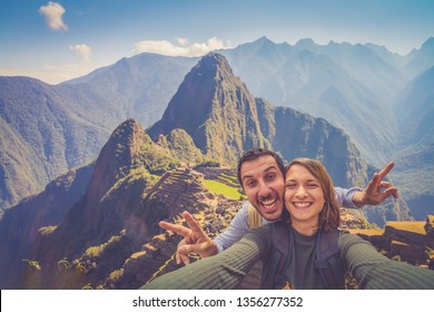 Happy Tourist Couple Traveling In Peru South America, Taking Selfie Of Machu Picchu