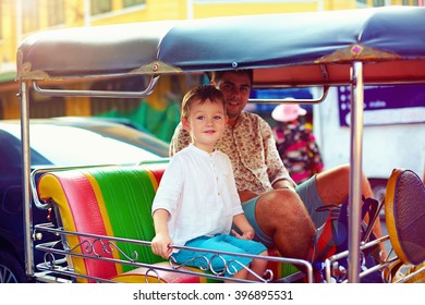 Happy Tourist Family Travel Through The Asian City On Tuk-tuk Taxi