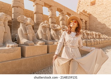 A Happy Tourist Girl Interested In Egyptology And Archaeology And Gets A Travel Experience At The Karnak Temple In Luxor Among Alley Of Sphinxes In Thebes