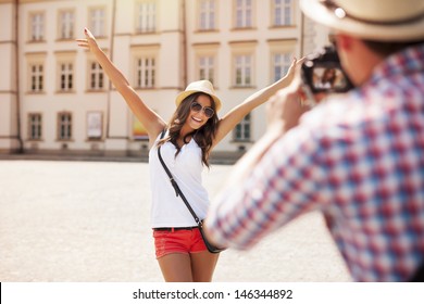 Happy Tourist Girl Posing For Photo 