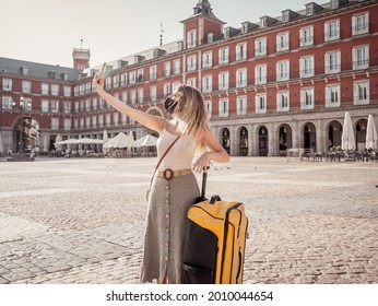 Happy Tourist In Madrid, Spain Europe, Traveling During Post-covid Summer Holidays. Woman Wearing Face Mask Taking Selfie Happy To Be Able To Travel Over The Summer. Travel Safe After Covid-19