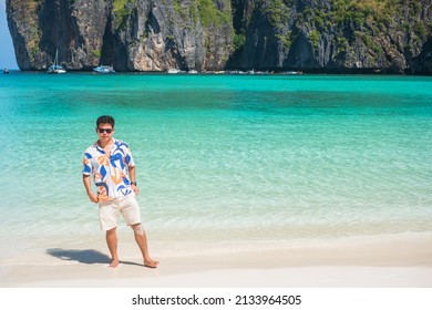 Happy Tourist Man At Maya Bay Beach On Phi Phi Island, Krabi, Thailand. Landmark, Destination Southeast Asia Travel, Vacation And Holiday Concept