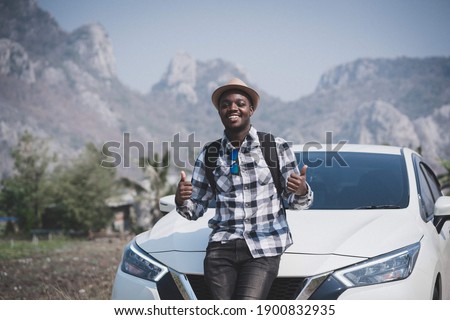 A happy tourist in the mountains.