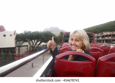 Happy tourist woman visiting the sights of the city