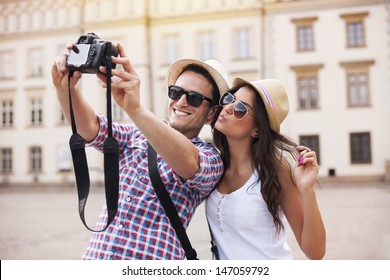 Happy tourists taking photo of themselves - Powered by Shutterstock