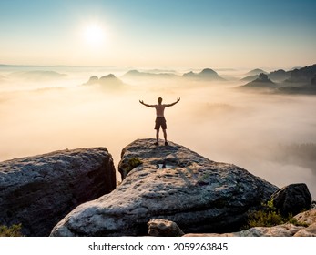 Happy Trail Runner At Rocky View Edge Raised Arms To Sun Greeting. Nature Lover And Landscape Hiker.