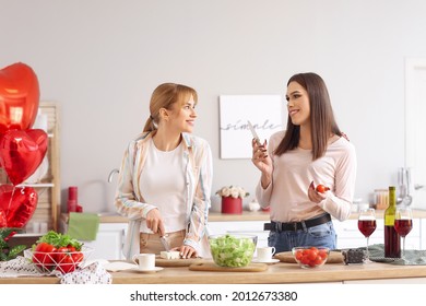 Happy Transgender Couple Celebrating Valentine's Day While Cooking Festive Dinner At Home