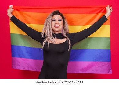 Happy transgender person raising a lgbt rainbow flag