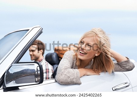 Happy, travel and couple in car for transportation on adventure, holiday or vacation with suitcases. Smile, love and young man and woman driving in vehicle for weekend road trip journey together.