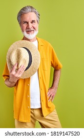 Happy Traveler Caucasian Man 60 Years Old Stand With Hat In Hands, Look At Camera And Smile, Isolated Green Background