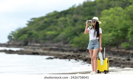 Happy traveler and tourism young women travel summer on the beach. Asian smiling people holding smartphone take photo  for relax outdoor destination leisure trip travel in holiday - Powered by Shutterstock