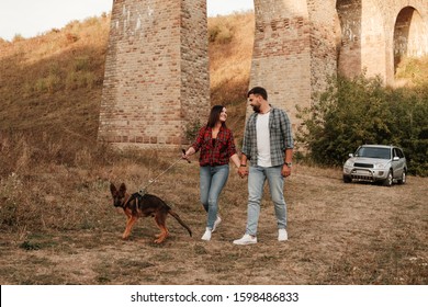 Happy Traveling Couple Together Enjoying Road Trip With Their Dog, Vacation Concept, Holidays Outside The City