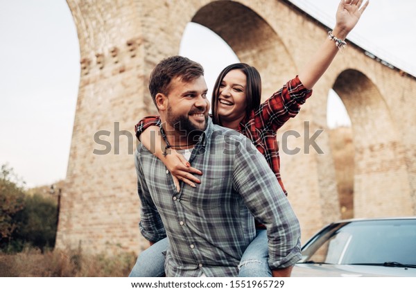 Happy Traveling Couple Together\
Enjoying Road Trip, Vacation Concept, Holidays Outside the\
City