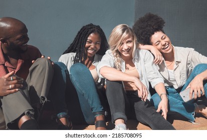 Happy, Trendy And Carefree Friends Laughing, Talking And Having Fun Enjoying Their Free Time Together Outside. Diverse Group Bonding, Hangout Out And Relaxing While Catching Up On The Weekend