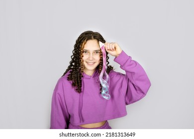 Happy Trendy Curly Teenager Girl With Colored Dyed Hair, Young Hipster On Pastel Background