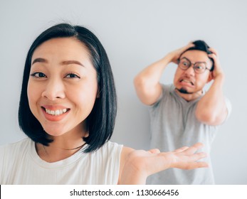 Happy Tricky Asian Wife Angry Loser Stock Photo 1130666456 Shutterstock image