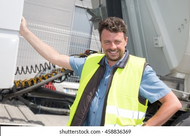 Happy Truck Driver Smiling At The Camera