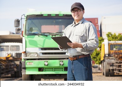 Happy Truck Driver Writing On A Document