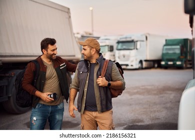 Happy Truck Drivers Talking While Greeting On Parking Lot Before The Ride. 