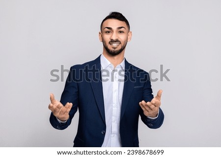 Happy turkish guy buisneesman in process speaks while shirt smart suit ellegant posing at camera. Stock photo © 