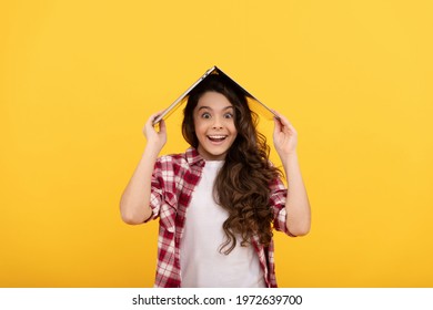 Happy Tween Girl Smile Holding Laptop Computer On Head Yellow Background, Distance Education.