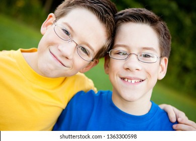 Happy Twin Boys Wearing Glasses - Outside Portrait