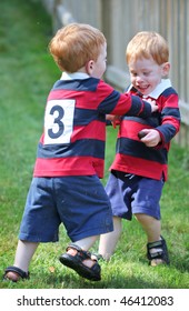 Happy Twin Boys Wearing Rugby Shirts