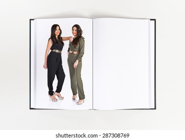 Happy twin sisters printed on book - Shutterstock ID 287308769